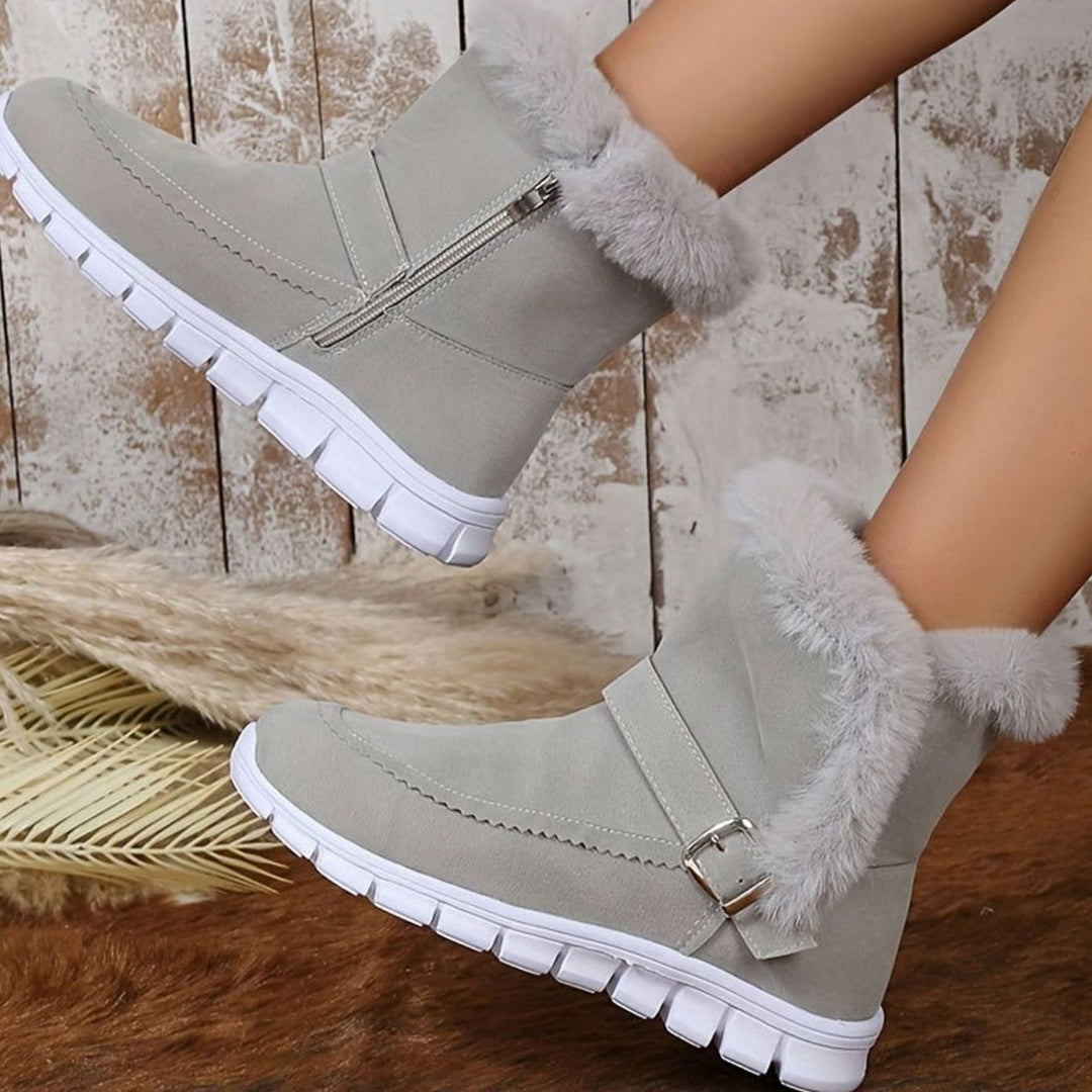 Faustine plush trim ankle snow boots in pink, close-up side profile with zipper