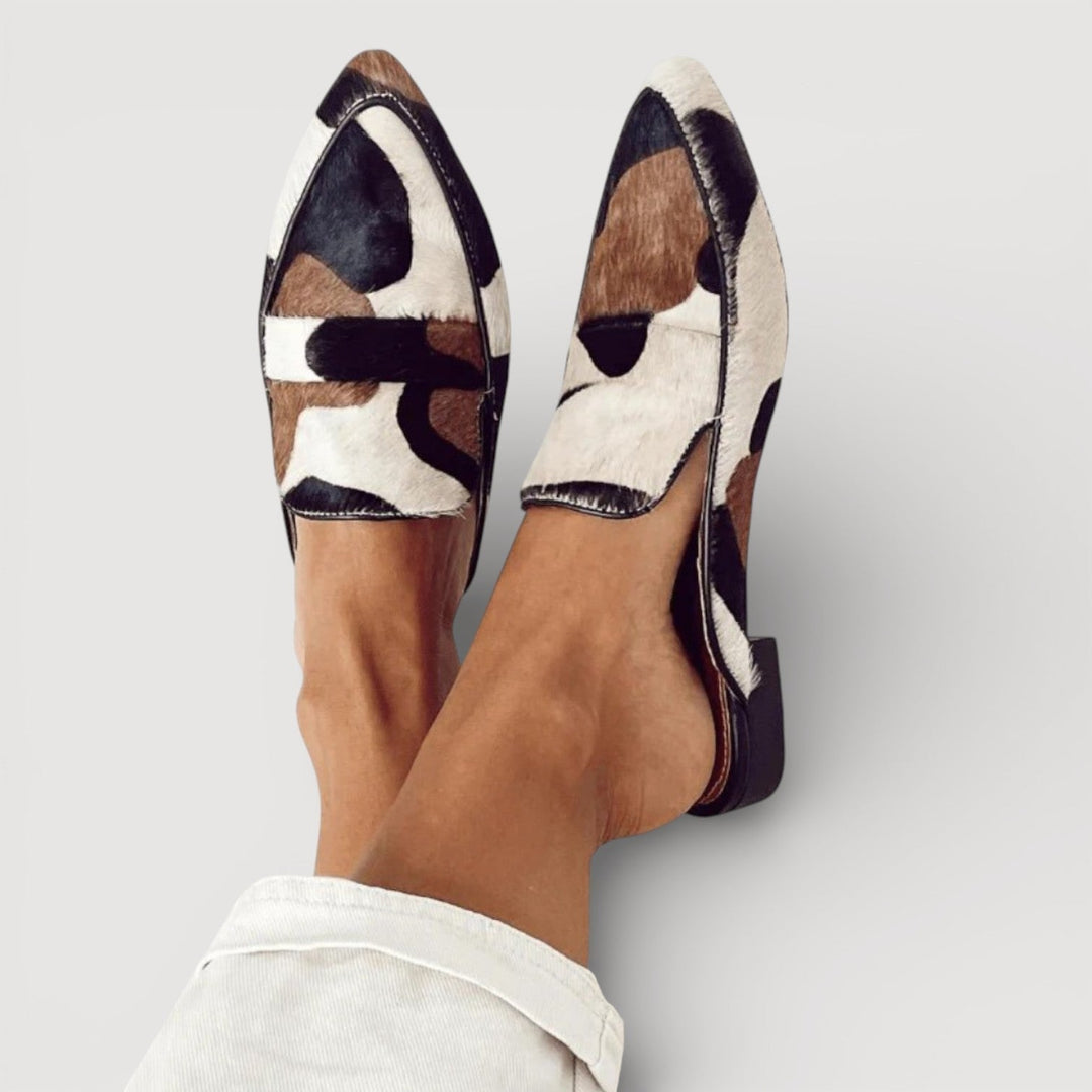 Odalys pointed toe animal print mules, front view on model