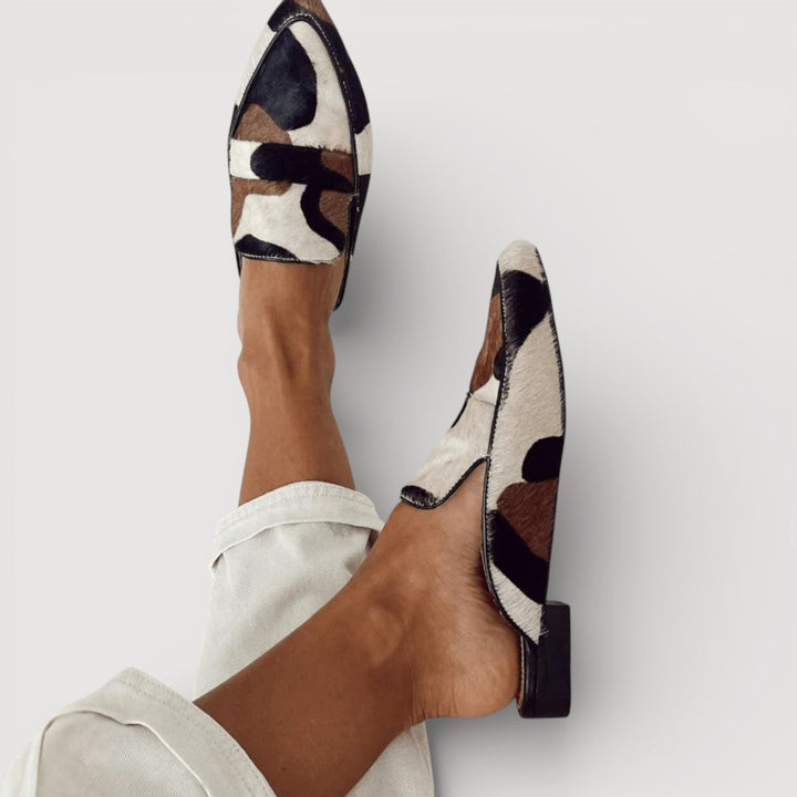 Odalys backless mules showing low block heel detail