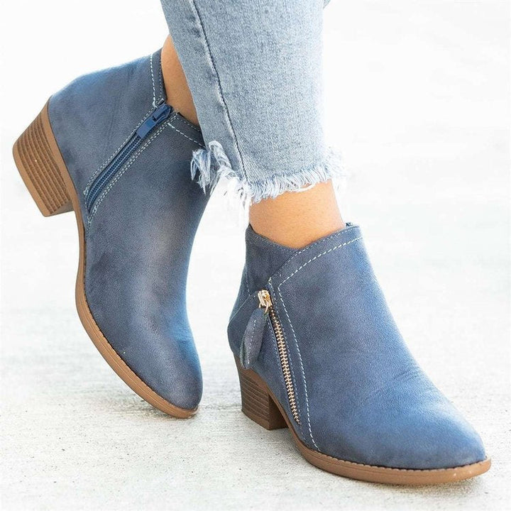 Brynlee pointed toe ankle boots in blue, side view with stacked heel