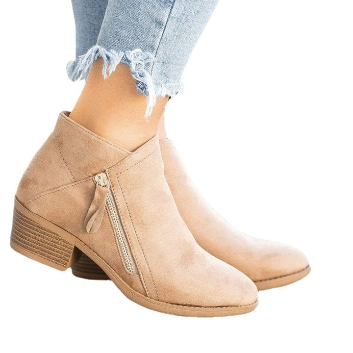 Brynlee pointed toe ankle boots in blue, side view with stacked heel