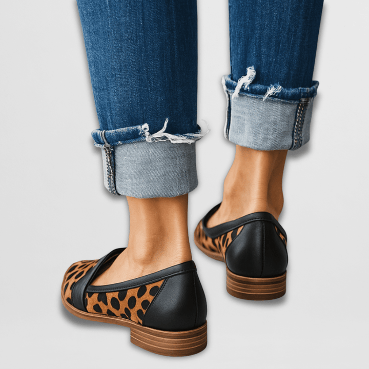 Marcella suede loafers in leopard print worn with cuffed jeans, front view
