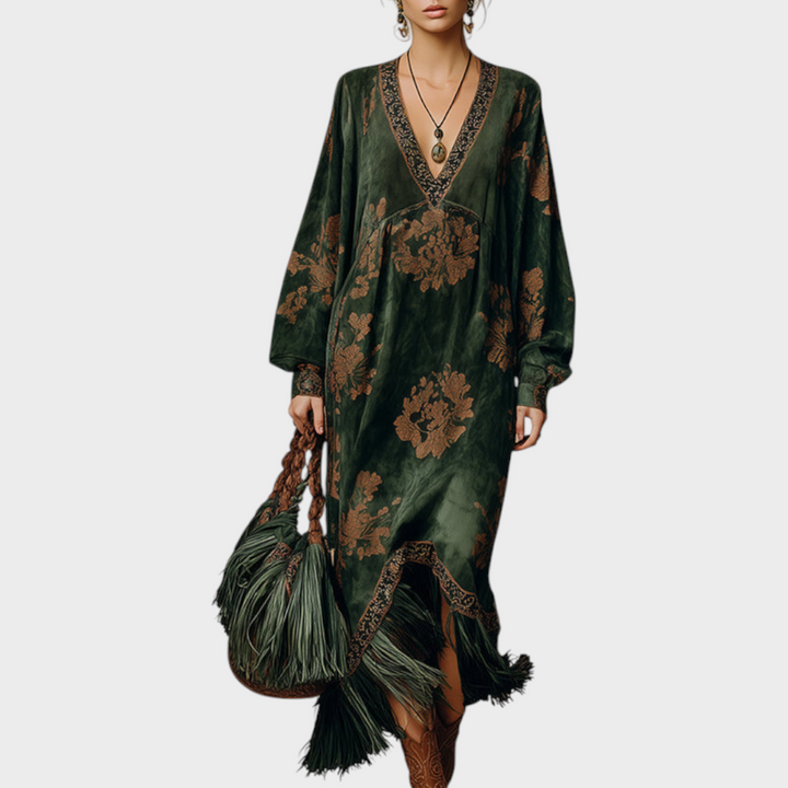 Marigold printed V-neck maxi dress with tasseled hem, close-up front view