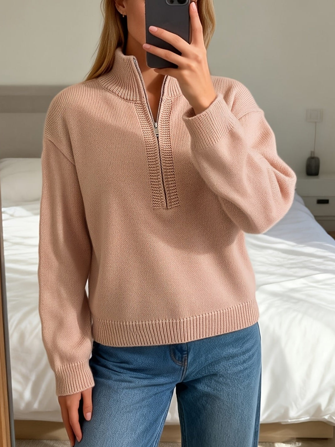 Rosalind quarter-zip mock neck pullover sweater, front view with phone in hand