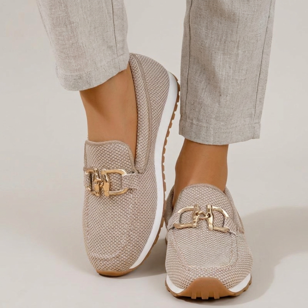 Delphine loafer sneakers worn with cropped trousers, front view