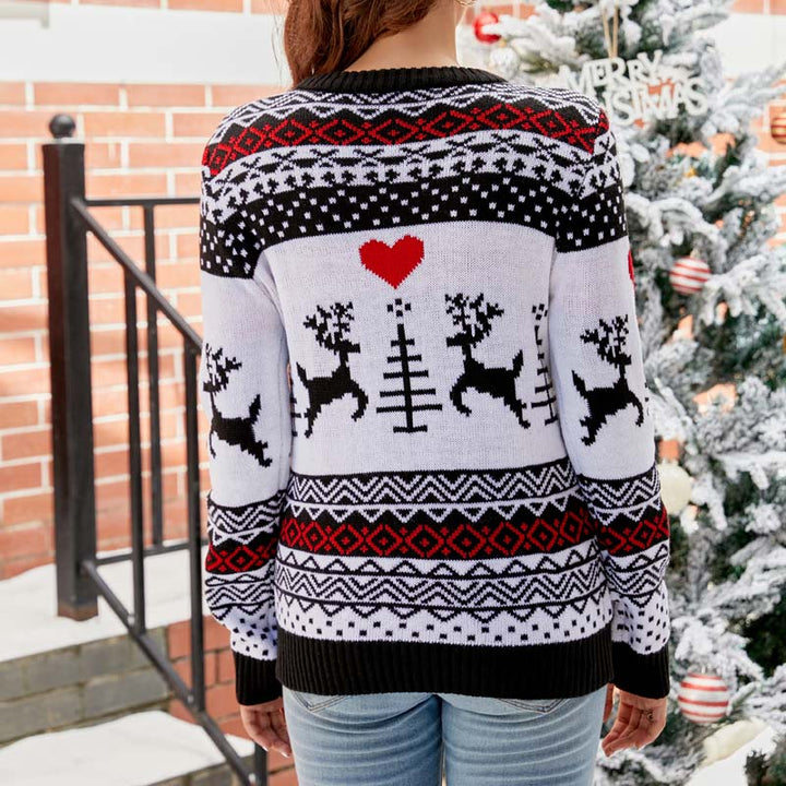 Everly reindeer print Christmas sweater, styled with jeans