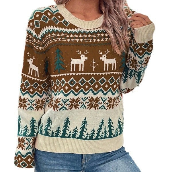 Marigolde reindeer print Christmas sweater, front view with hands in pockets