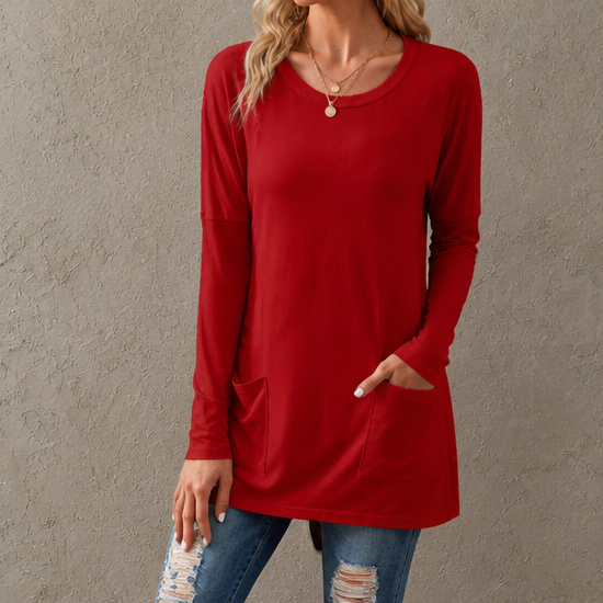 Harlow tunic top, back view paired with leggings and sneakers