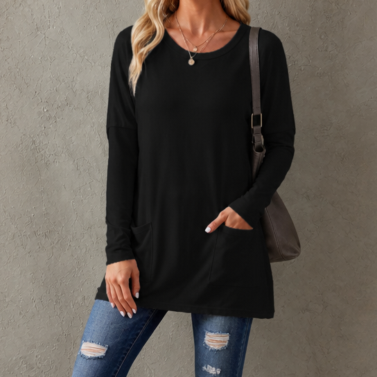 Harlow tunic top, back view paired with leggings and sneakers