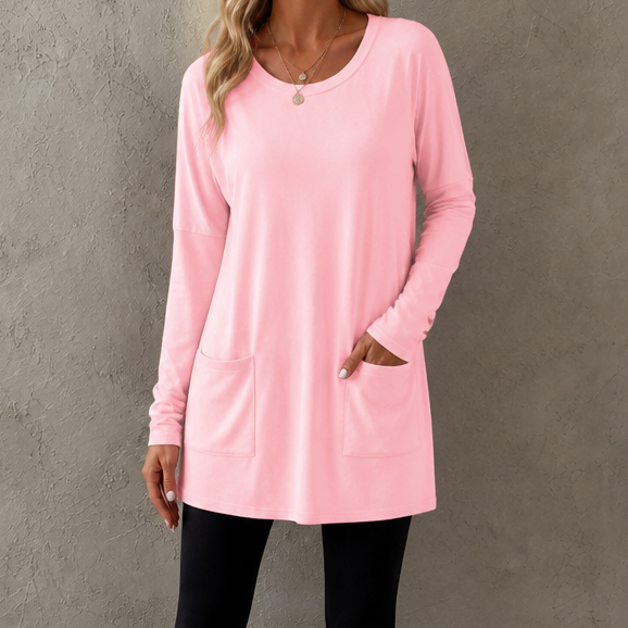 Harlow tunic top, back view paired with leggings and sneakers