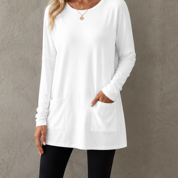 Harlow tunic top, back view paired with leggings and sneakers