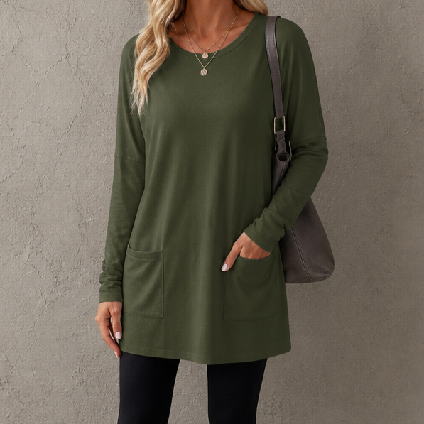 Harlow tunic top, back view paired with leggings and sneakers