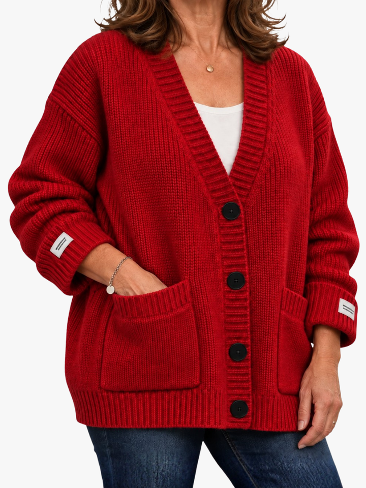 Marguerite ribbed button up cardigan in red, front view with hand in pocket