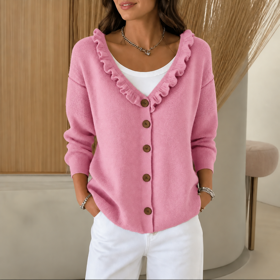 Marcelline ruffle collar cardigan in a kitchen setting, holding a mug