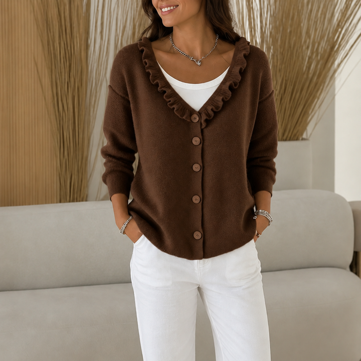 Marcelline ruffle collar cardigan in a kitchen setting, holding a mug