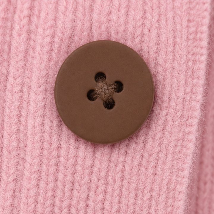 Marcelline ruffle collar cardigan in a kitchen setting, holding a mug