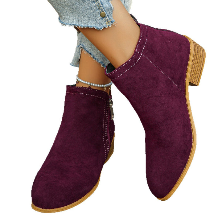 Verlaine black ankle boots, crossed-leg front view