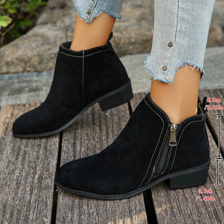 Verlaine black ankle boots, crossed-leg front view