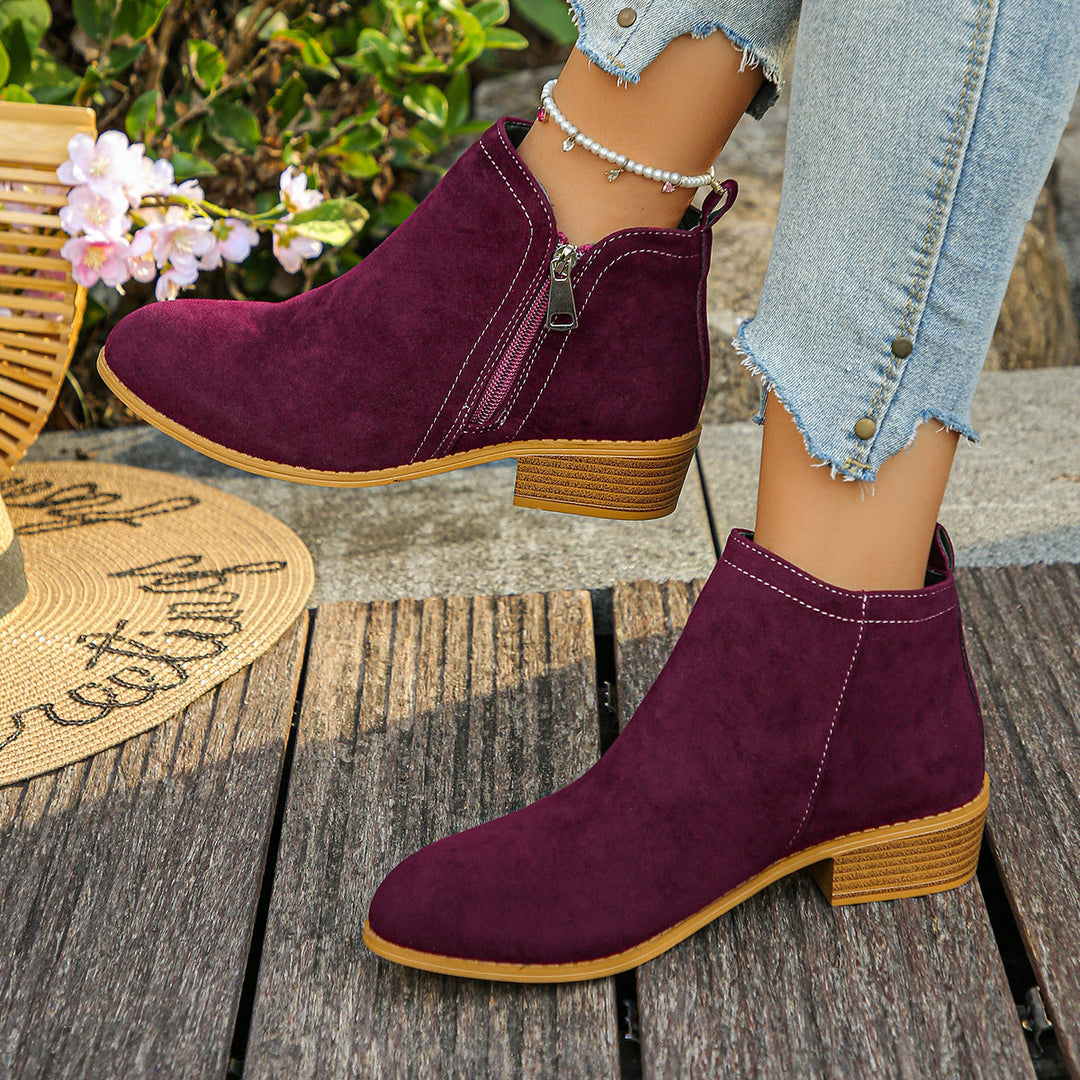 Verlaine black ankle boots, crossed-leg front view
