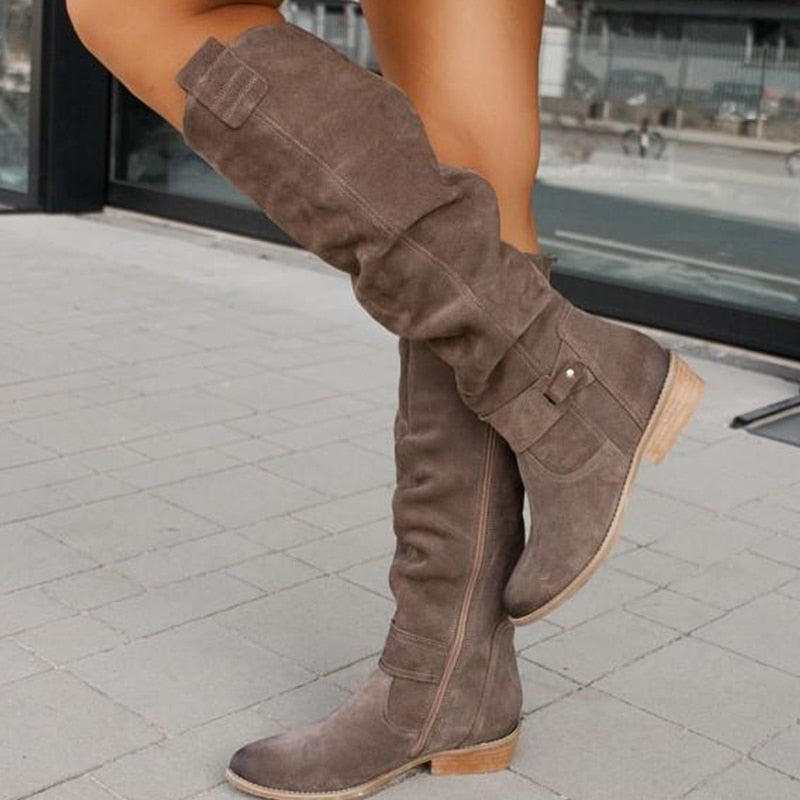 Rosamund slouchy knee-high flat boots in taupe, walking pose