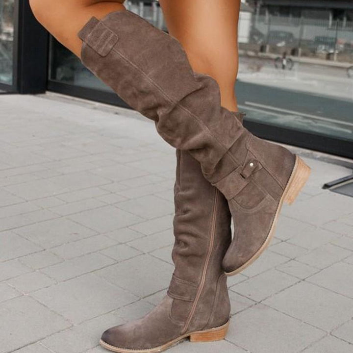 Rosamund slouchy knee-high flat boots in taupe, walking pose