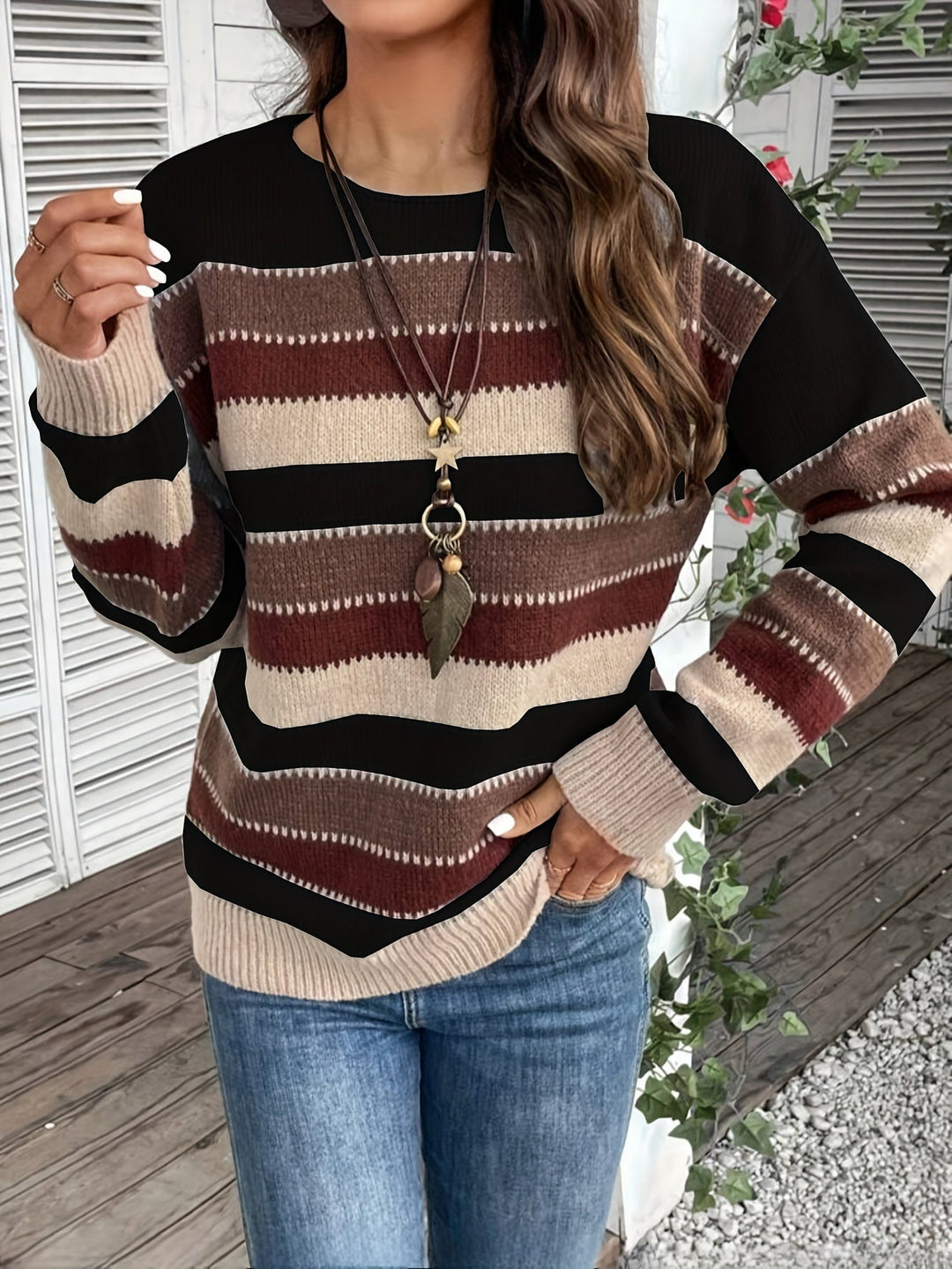 Odessa striped oversized sweater, side view showing sleeve and hem detail