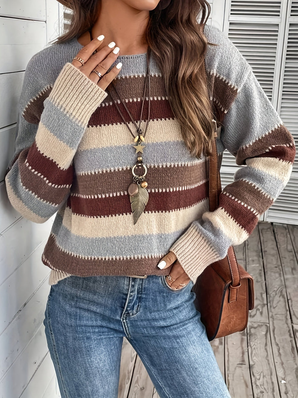 Odessa striped oversized sweater, front view styled with jeans and crossbody bag