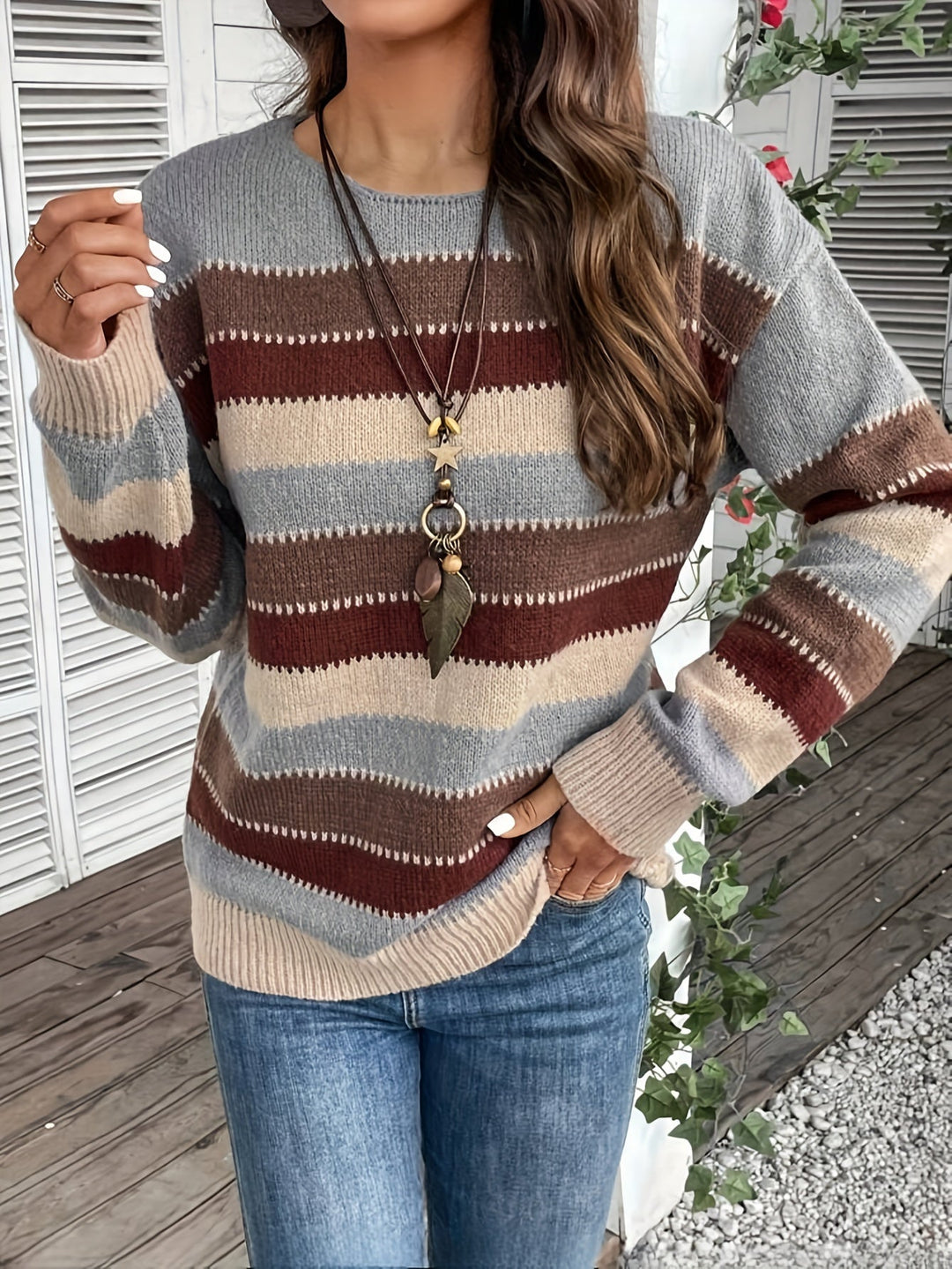 Odessa striped oversized sweater, side view showing sleeve and hem detail