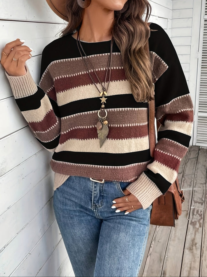 Odessa striped oversized sweater, side view showing sleeve and hem detail