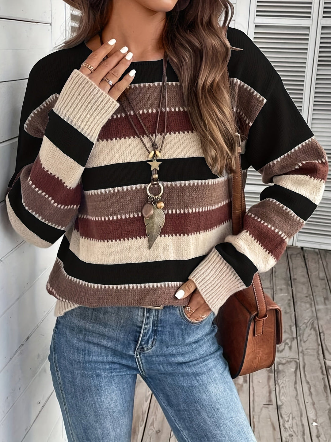 Odessa striped oversized sweater, side view showing sleeve and hem detail