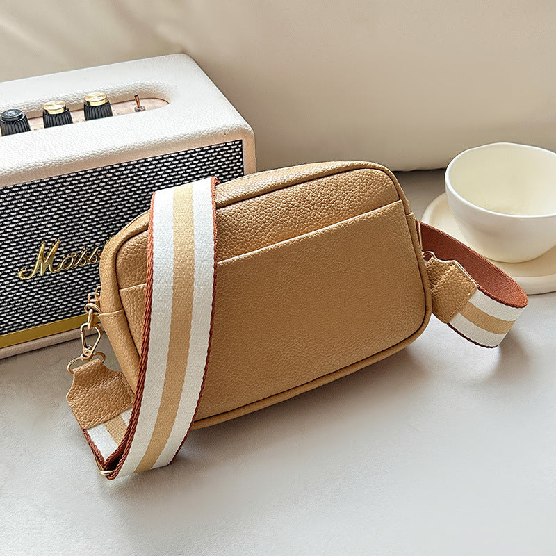 Vivienne khaki leather crossbody bag with striped strap, side view