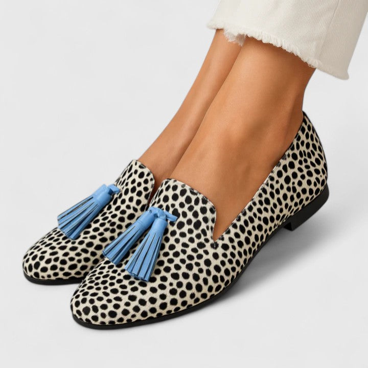 Priscilla printed tassel loafers worn on feet, front view close-up