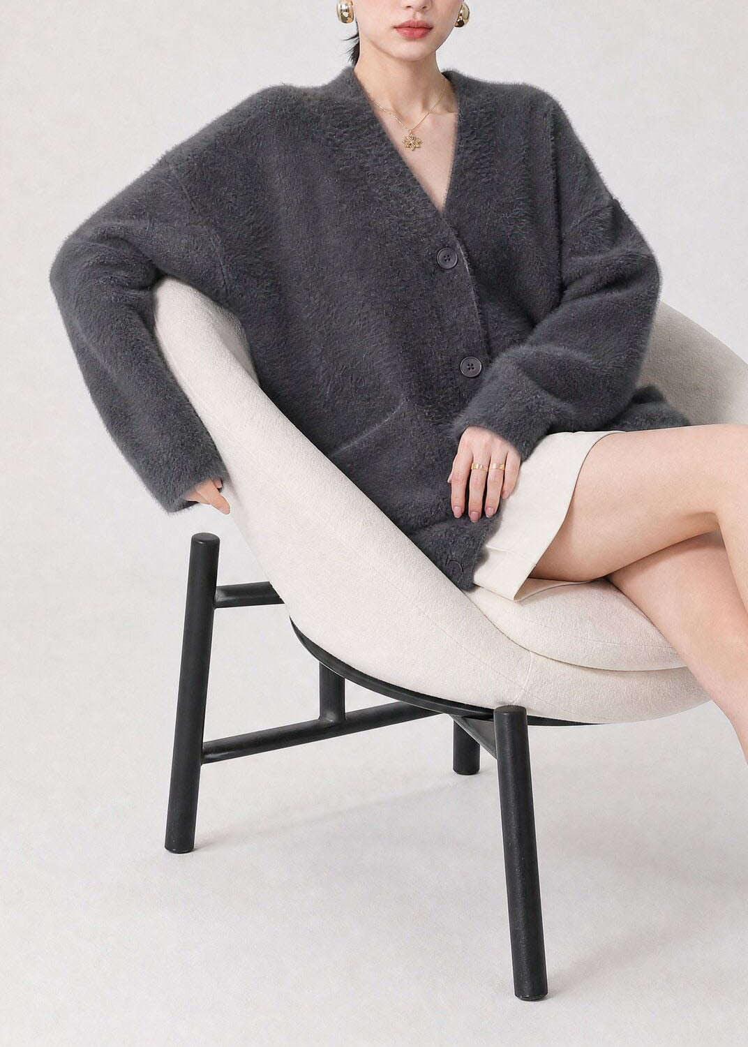 Esperanza gray cardigan, seated side view showing relaxed fit