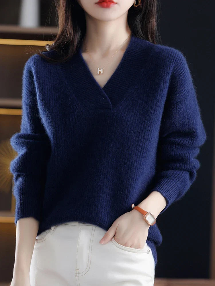 Marisabel beige V-neck sweater styled with belt, close-up