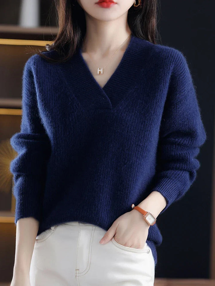 Marisabel beige V-neck sweater styled with belt, close-up