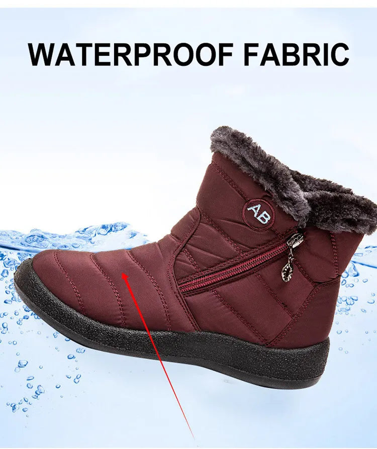 Marcelline brown ankle snow boots with fur collar, pair on flooring