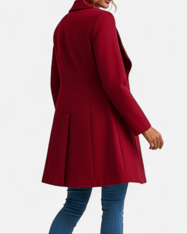 Thessaly wide collar midi coat in deep red, back view showing pleated hem