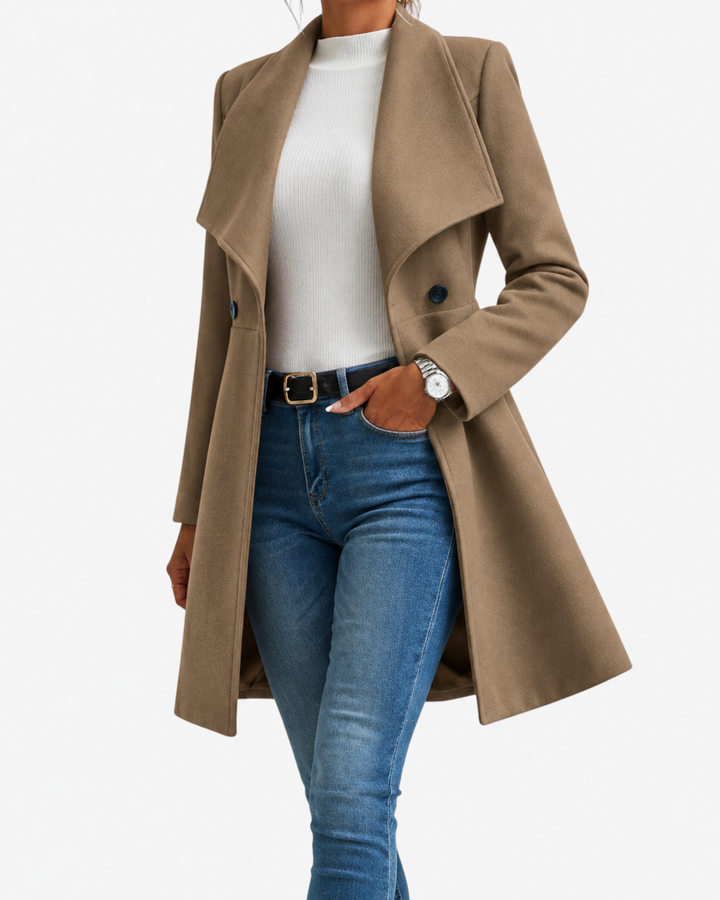 Thessaly wide collar midi coat in tan, front view with hand in pocket