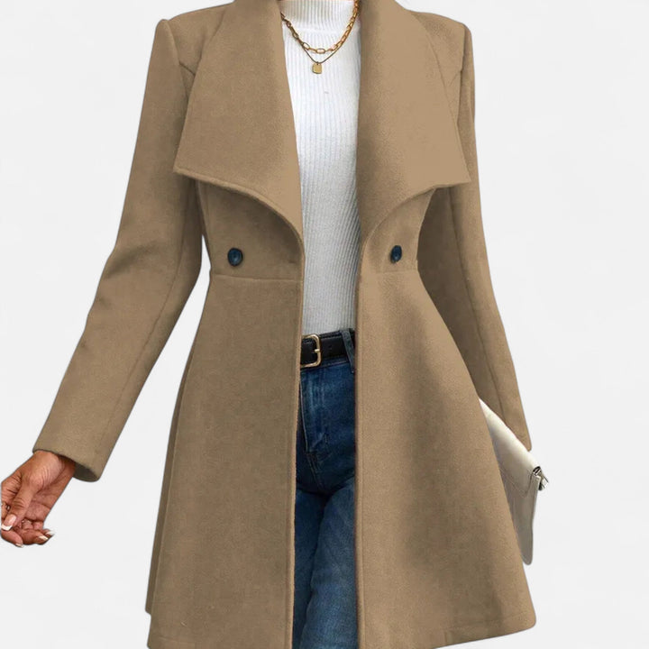 Thessaly wide collar midi coat in tan, front view with hand in pocket
