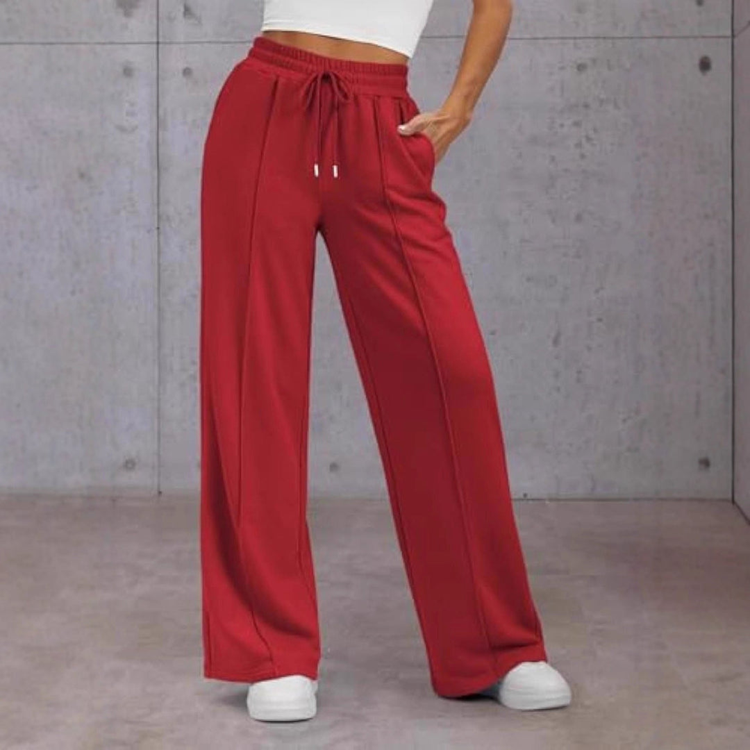 Vienna wide leg sweatpants in red, front view with hand in pocket