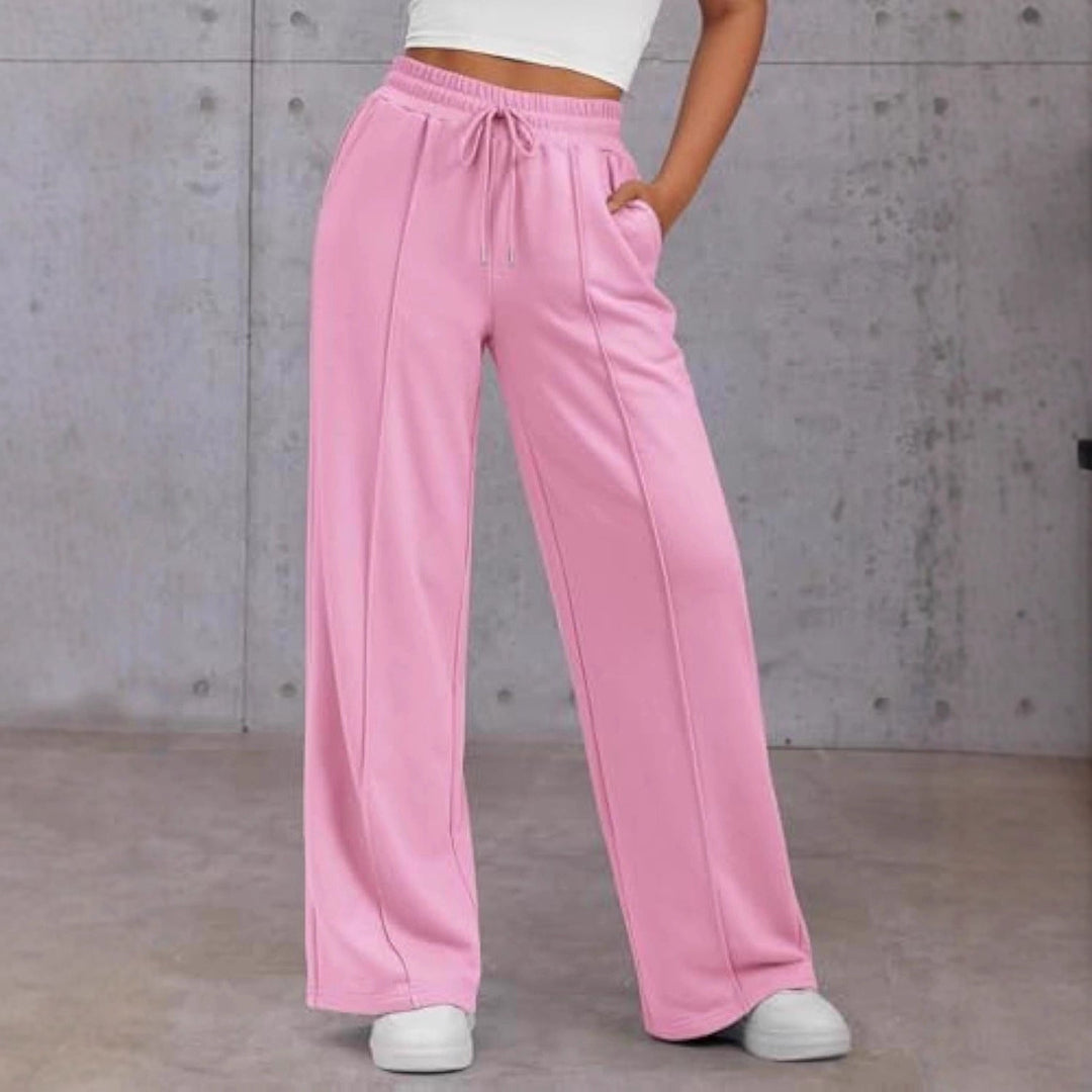 Vienna wide leg sweatpants in pink, front view with hand in pocket