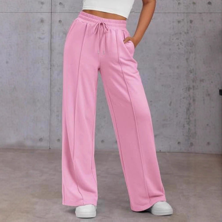 Vienna wide leg sweatpants in pink, front view with hand in pocket