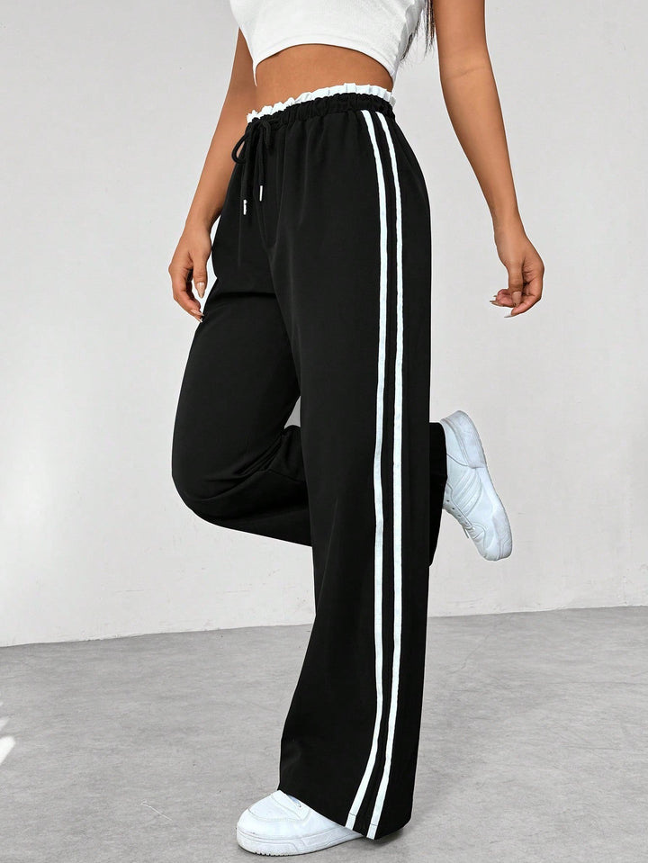 Rosalie wide leg side stripe sweatpants in black, side view