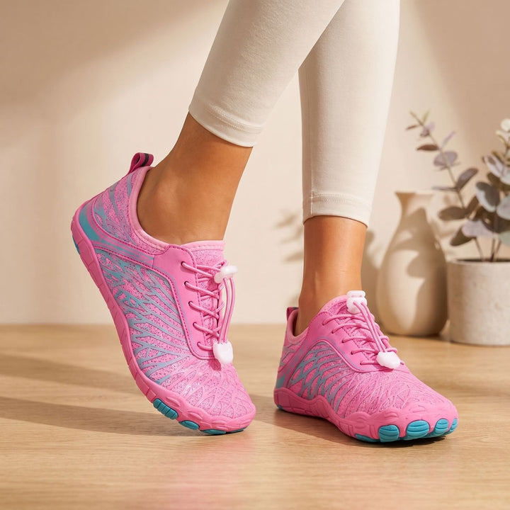 Marisela wide toe box walking sneakers in pink, worn on feet, side view