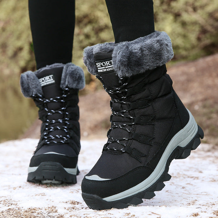 Odessa black fleece snow boots worn outdoors, front view
