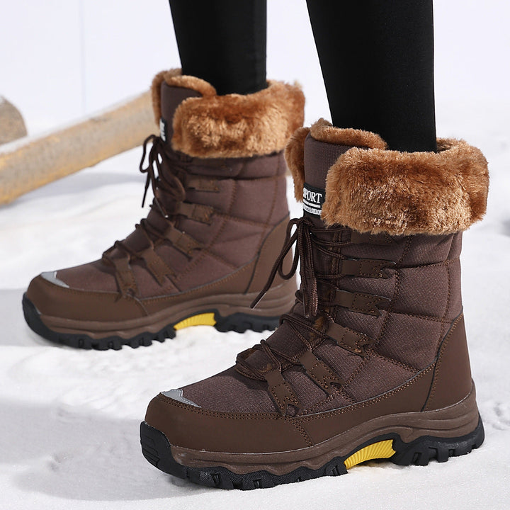 Odessa black fleece snow boots worn outdoors, front view