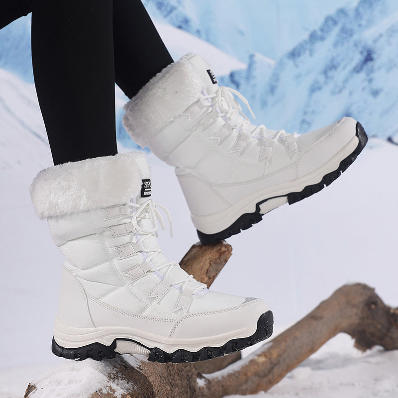 Odessa black fleece snow boots worn outdoors, front view