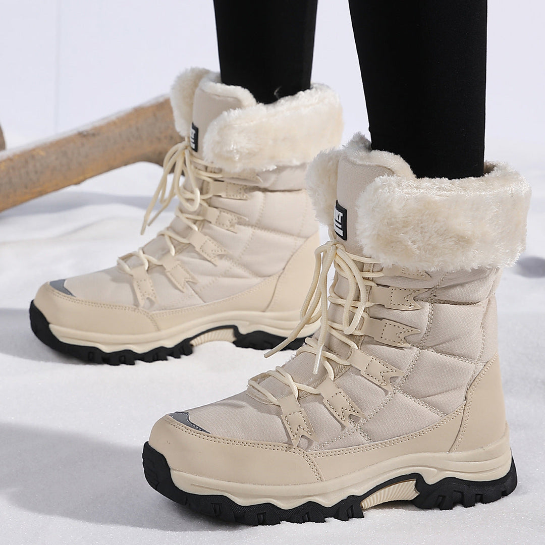 Odessa black fleece snow boots worn outdoors, front view