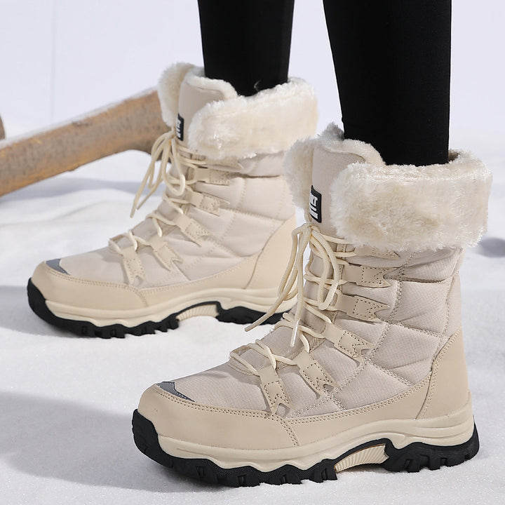 Odessa black fleece snow boots worn outdoors, front view
