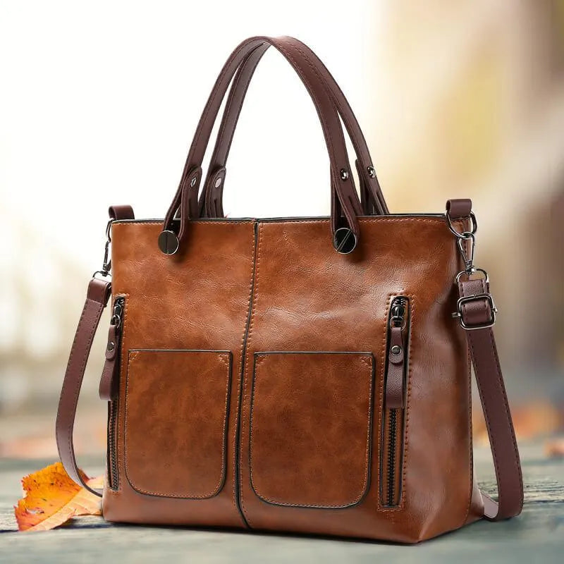 Marguerite leather tote bag with front zip pockets, front view
